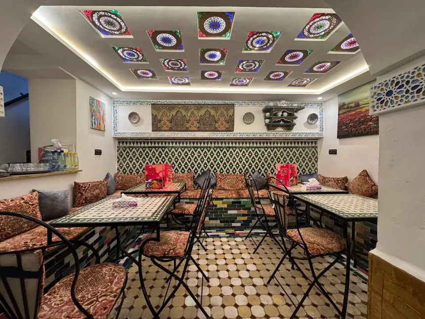 Zellige-lined dining room at Fassie Délice in Fès