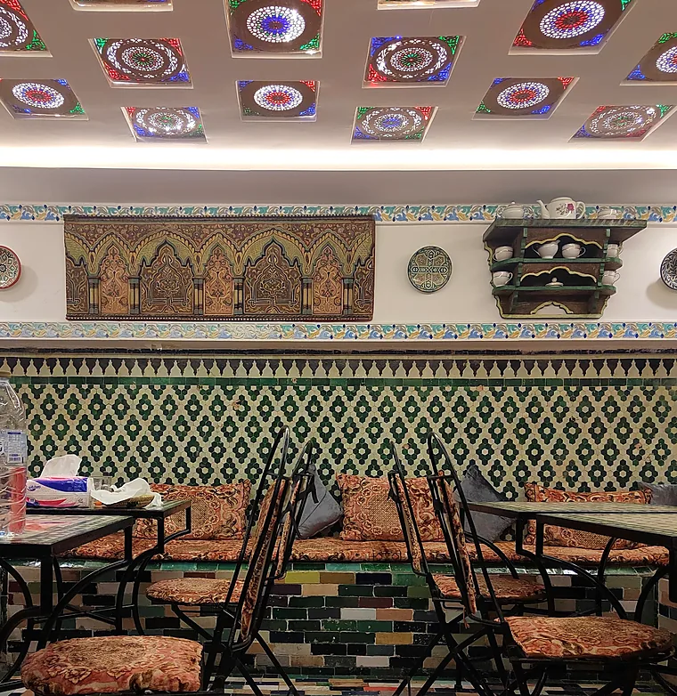 Zellige-lined dining room at Fassie Délice in Fès
